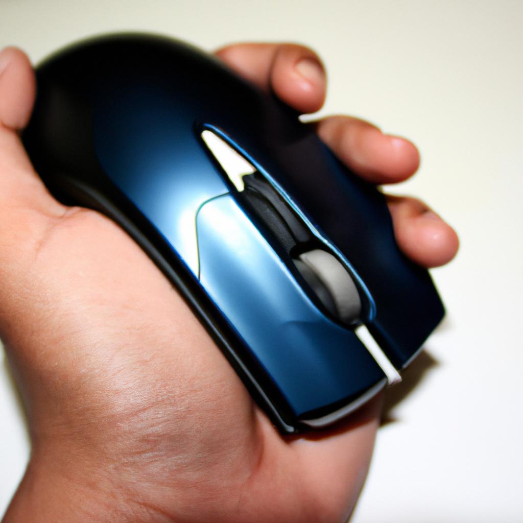 Person holding a computer mouse