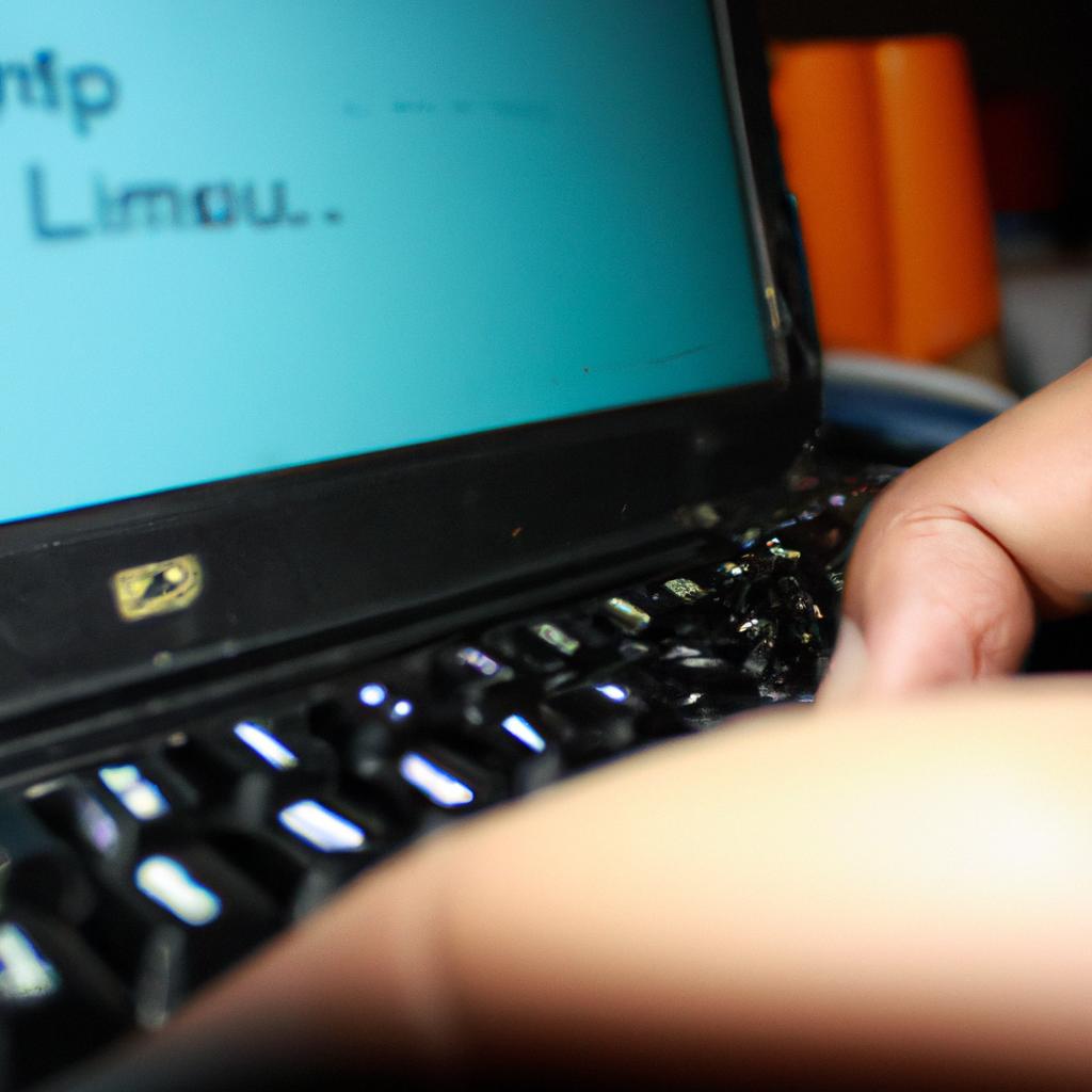 Person using computer with Linux