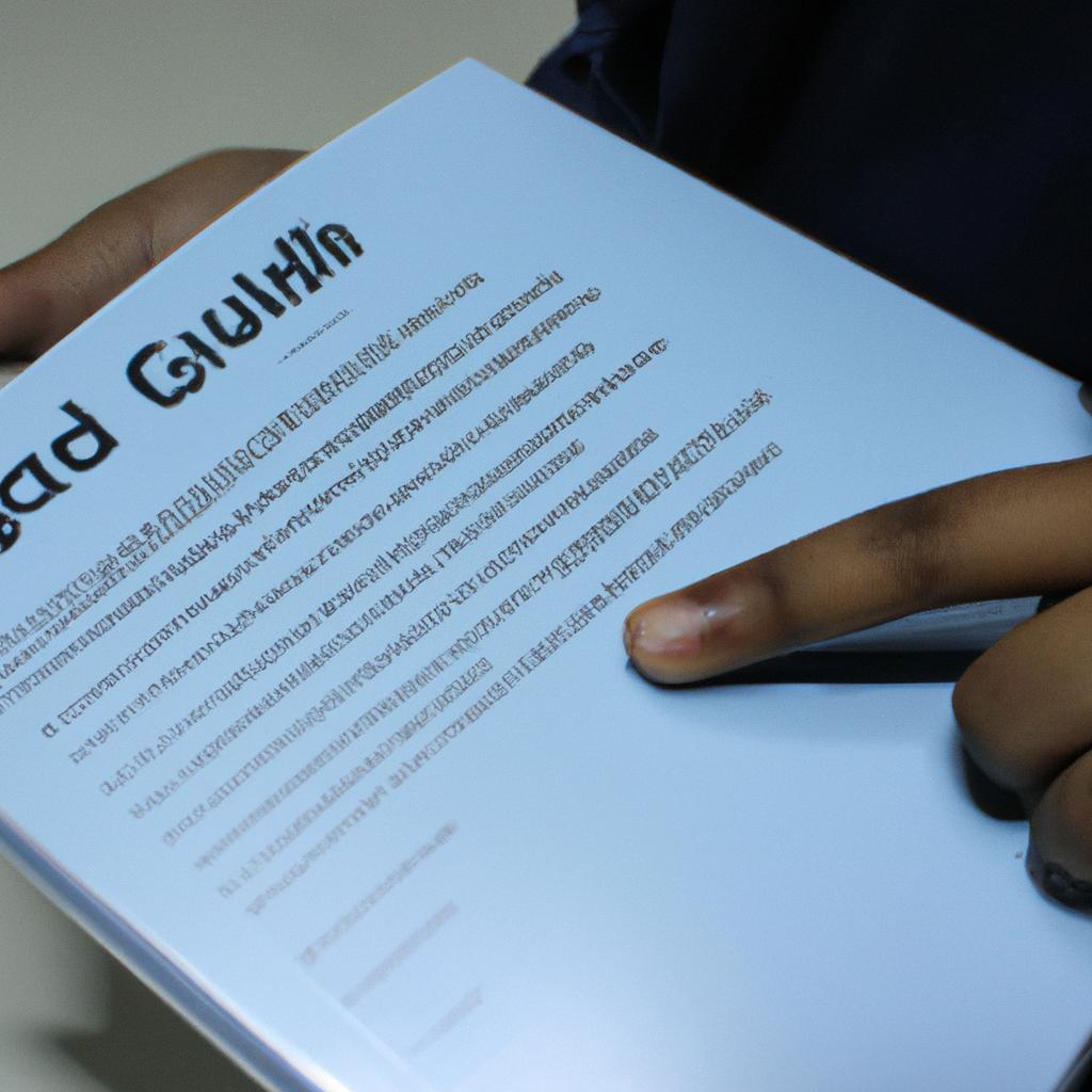 Person holding laptop, reading guide